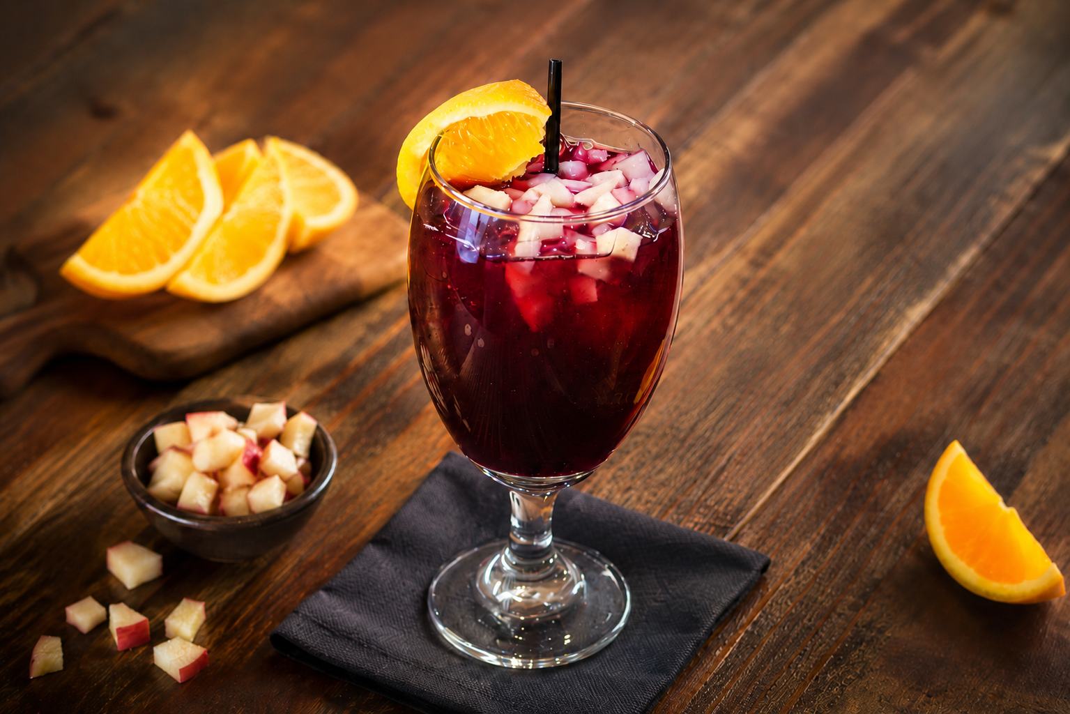 Sangría with orange and apple in a stemmed glass